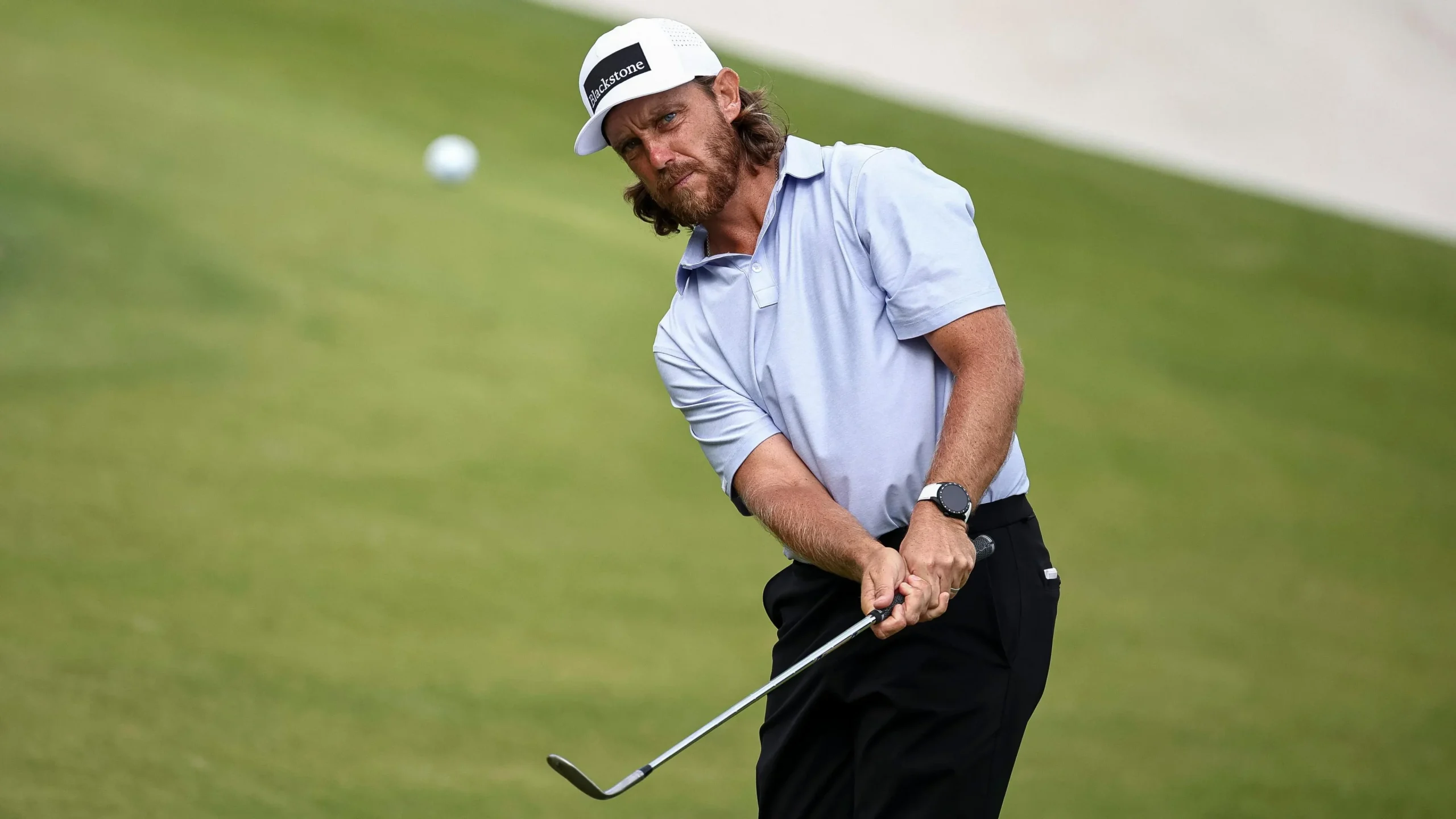 Tommy Fleetwood playing a chip shot