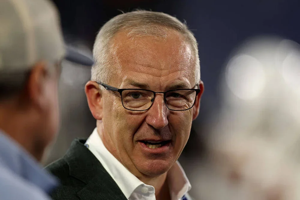 Greg Sankey talks to someone on the field before an October game between Texas and Kentucky.